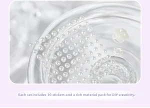 Macro detail of DIY pearl sticker kit showing 10 resin pieces and floral accessories