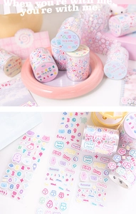 Detail of cute pink cartoon bear and rabbit themed washi tape and stickers for DIY journals