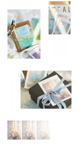 Artistic impressionist memo pads with flower and seascape designs in premium gift packaging