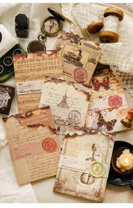 Dettaglio macro di carta per scrapbooking vintage con bordi bruciati e motivi retrò