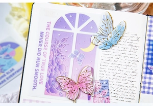Detail of dreamlike purple butterfly stickers with gold foil lines for DIY scrapbooking