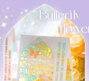 Macro shot of laser-cut PVC cards with holographic butterfly and lily flower patterns