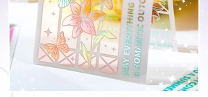 Detail of floral PVC card featuring laser-foiled lily and orange butterfly graphics