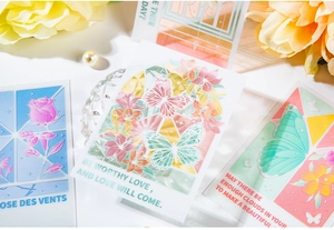 Macro shot of transparent PET butterfly and floral stickers with laser gold details