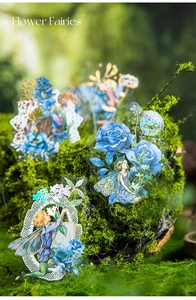 Detail of Flower Fairies PET stickers with blue floral motifs on natural moss background