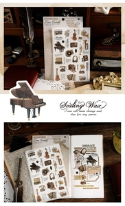 Macro detail of retro stationery stickers featuring vintage musical instruments and cameras