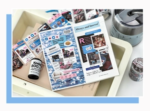 Close-up of vintage UI style aesthetic scrapbooking stickers and deco tape in a notebook