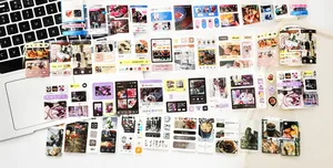 Detail of vintage social media app interface stickers and washi tape on a laptop keyboard