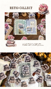 Macro detail of retro stationery stickers featuring typewriters, books and floral motifs