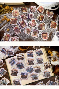 Macro detail of vintage stationery stickers featuring old books and antique typewriters