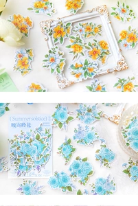 Flat lay of vintage floral vase collection stickers with white frames and lace accents