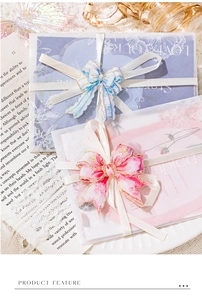 Detailed view of floral PET stickers with ribbon accents and translucent envelopes
