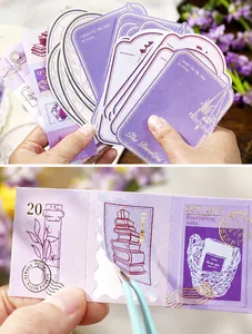 Close-up of vintage purple sticker set with die-cut shapes and gold foil Library text