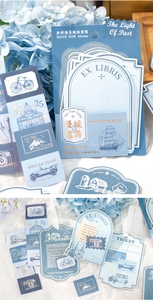 Detail of vintage French travel stickers with gold foil accents and Morandi blue notes