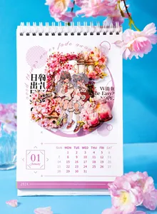 Detail of 2024 anime desk calendar with cherry blossom illustrations and white spiral binding