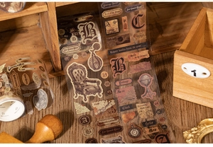 Detail of vintage PET decorative tape featuring Victorian items and retro labels