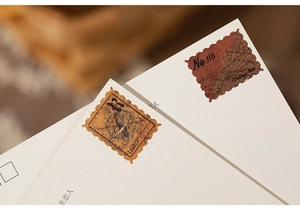 Close-up of vintage map stamps and nautical motifs on decorative scrapbooking paper