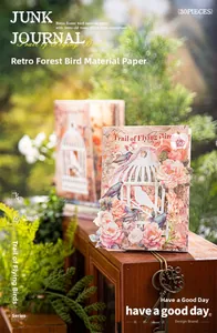 Detail of vintage forest bird junk journal paper with 3D layered laser cutouts