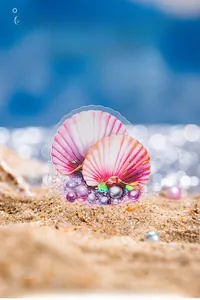 Detail of seashell stickers with pearl elements on a soft bokeh beach background