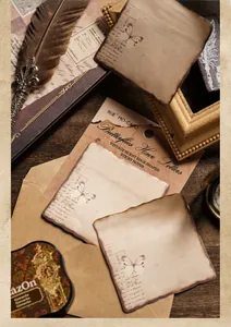 Macro shot of vintage burnt-edge sticky notes with butterfly motifs and script for journaling