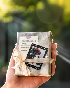 DIY gift box decorated with marble pattern paper, film stickers and a natural hemp bow