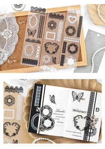 Detail of vintage PET lace stickers featuring black and white floral patterns on a journal