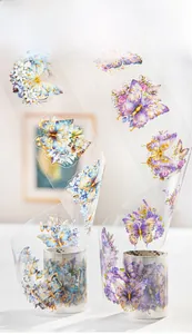 Detail view of PET butterfly decorative tape with gold foil accents and floral patterns