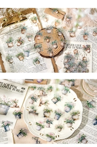 Macro di adesivi PET botanici vintage con motivi floreali ad acquerello su vecchio giornale