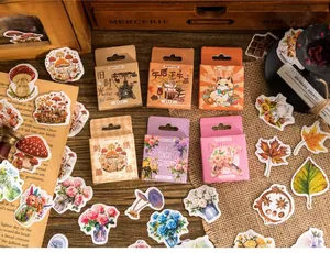 Macro detail of vintage floral themed stickers in boxed sets for scrapbook decoration