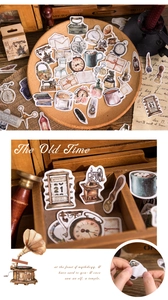 Macro shot of vintage scrapbooking stickers with old typewriter and antique clock themes