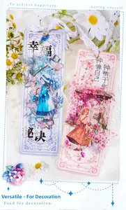 Close-up of decorative PET tape cards with anime girl illustrations and lace ribbons