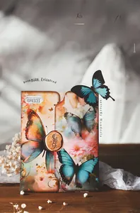 Detail of vintage scrapbooking paper with butterfly and floral motifs and gold wax seal