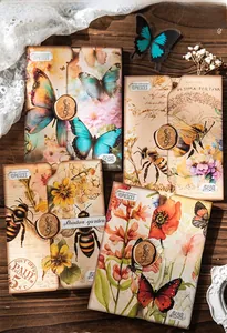 Detail show of vintage shadow garden paper envelopes with butterfly and floral patterns