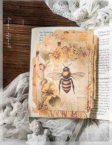 Detail of vintage scrapbooking paper with honeybee prints and rustic textures