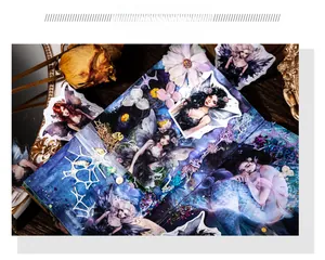 Detail view of magical fairy and mermaid decorative PET stickers on a vintage planner