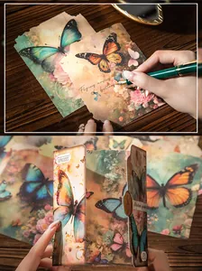 Detail of vintage butterfly scrapbooking paper showing writing texture and torn edges
