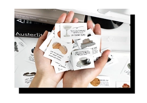 Close-up of lifestyle-themed aesthetic stickers featuring coffee and croissant illustrations