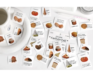 Close-up of 3D food stickers on white ceramic plate for creative DIY journaling decor