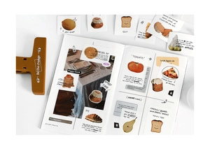 Detailed view of food themed DIY journal stickers including pizza and cakes for scrapbooking