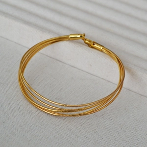 Minimalist multi-layer snake chain bracelet in gold-plated brass with lobster clasp