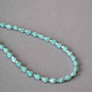 Minimalist turquoise beaded necklace with faceted green stones and silver accents