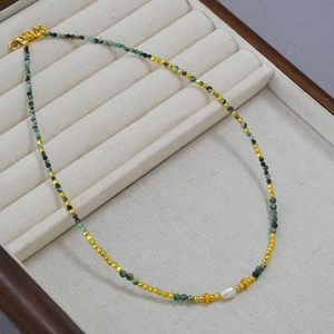 Retro African Turquoise beaded necklace with gold spacers and a freshwater pearl accent