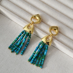 Bohemian tassel earrings with golden geometric studs and green beaded strands in 45-degree view