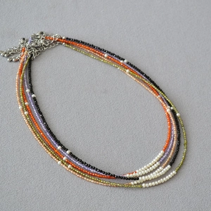 Multilayer beaded necklace with freshwater pearls and colorful stones in boho style