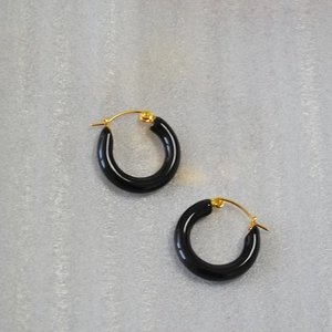 Minimalist black enamel hoop earrings with gold-toned metal clasp for a retro chic style