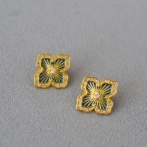 Vintage golden four-leaf clover stud earrings with blue enamel and sparkling zircon