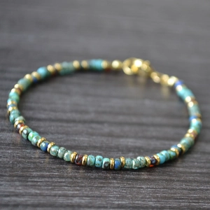 Handmade Bohemian beaded bracelet with turquoise and navy Miyuki beads and gold lobster clasp