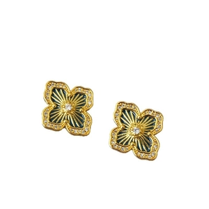 Golden sunburst four-leaf clover stud earrings with blue enamel and crystal accents