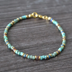 Bohemian handmade Miyuki beaded bracelet with turquoise stones and gold metal accents