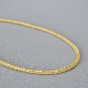 Chic gold plated brass mesh chain necklace featuring a delicate woven starburst texture